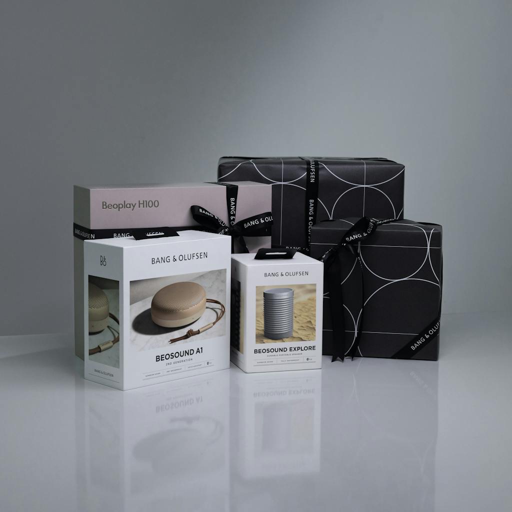 Stylish display of Bang & Olufsen Beosound and Beoplay speakers with elegant gift packaging.