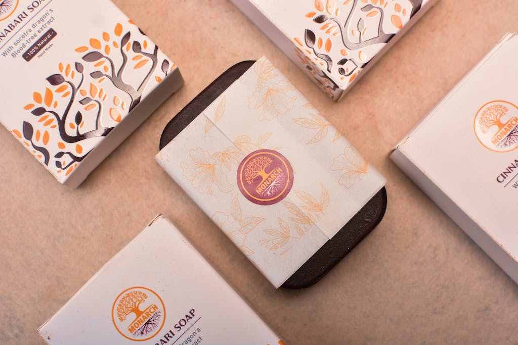 Elegant Monarch soap packaging in a flat lay with artistic design, showcasing premium quality body care products.