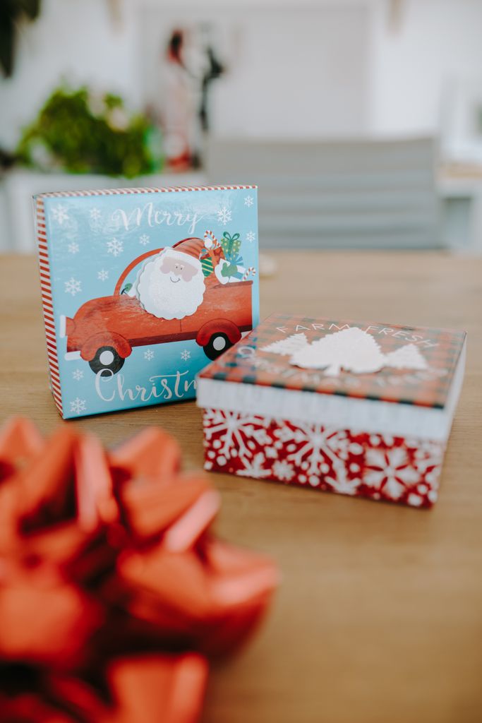 Colorful Christmas gift boxes with festive decor, perfect for holiday celebrations.
